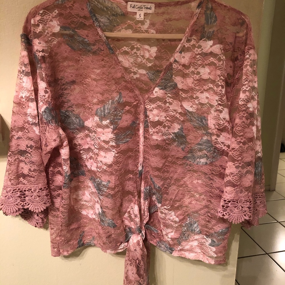Beautiful lace, see through blouse with tie bottom